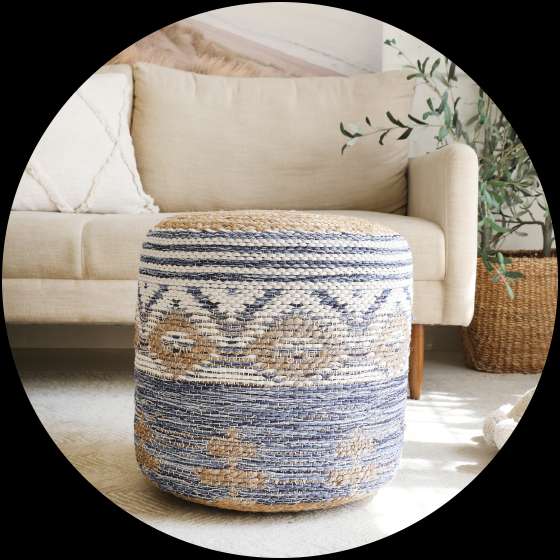 Round woven ottoman with blue and tan patterns.
