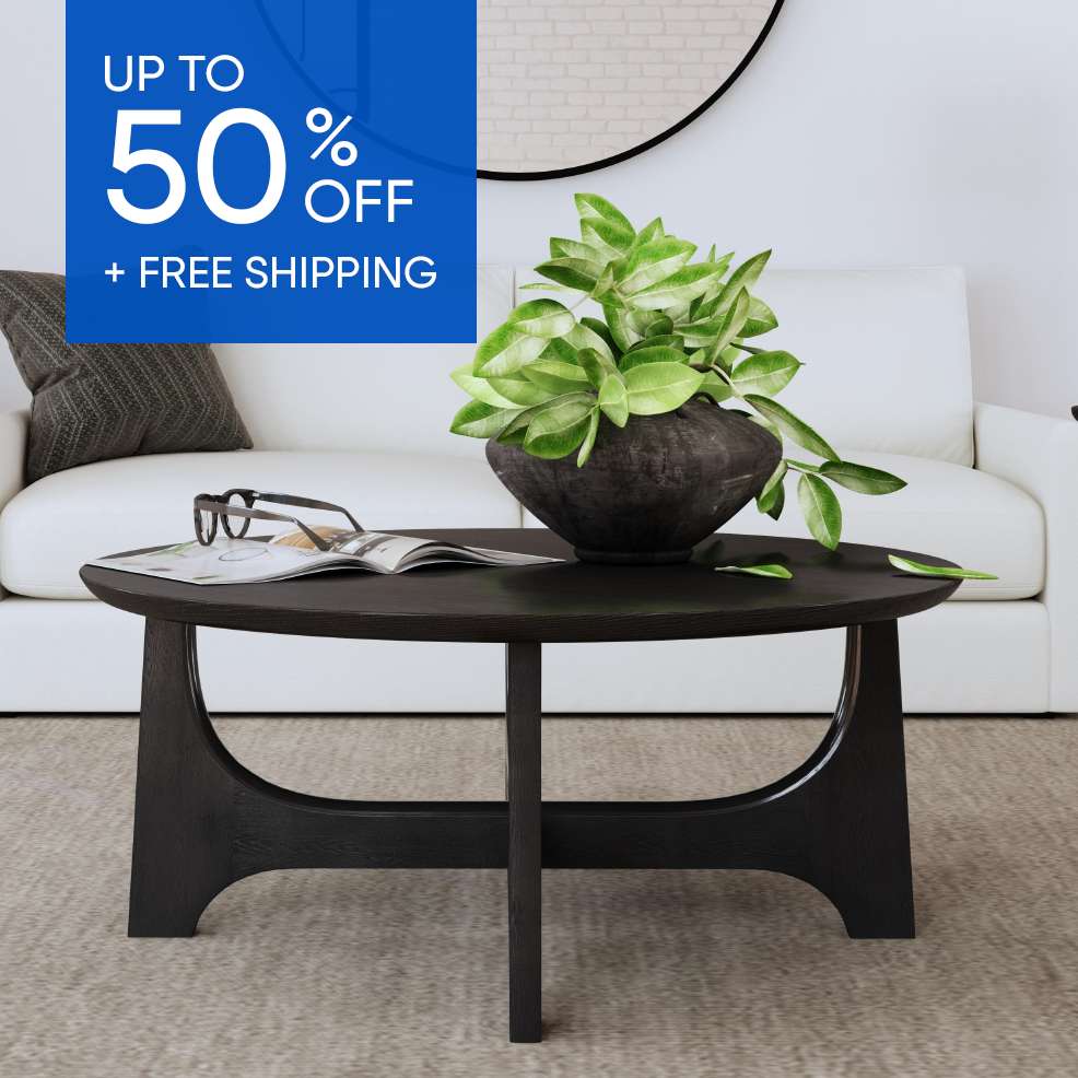 UP TO 50% OFF + FREE SHIPPING. A black coffee table with a plant on top.

