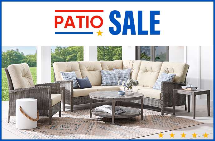 PATIO SALE. Outdoor sectional sofa with a matching chair and coffee table.
