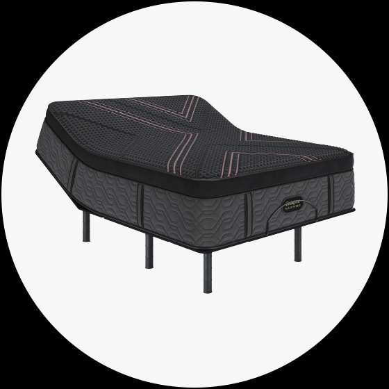Black adjustable bed with pink accents.
