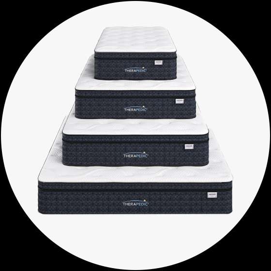Four stacked mattresses with the brand name "THERAPEDIC" visible.
