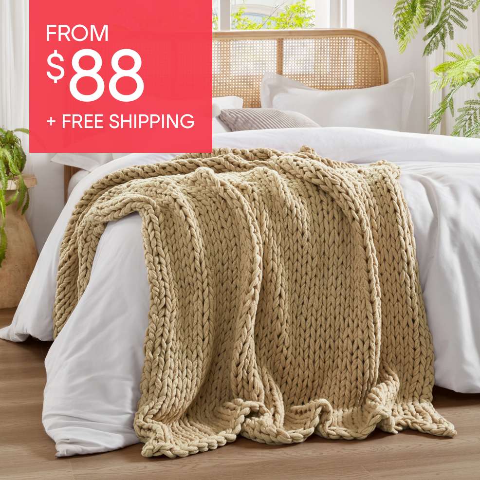From $88 + Free Shipping. A beige chunky knit blanket on a bed.
