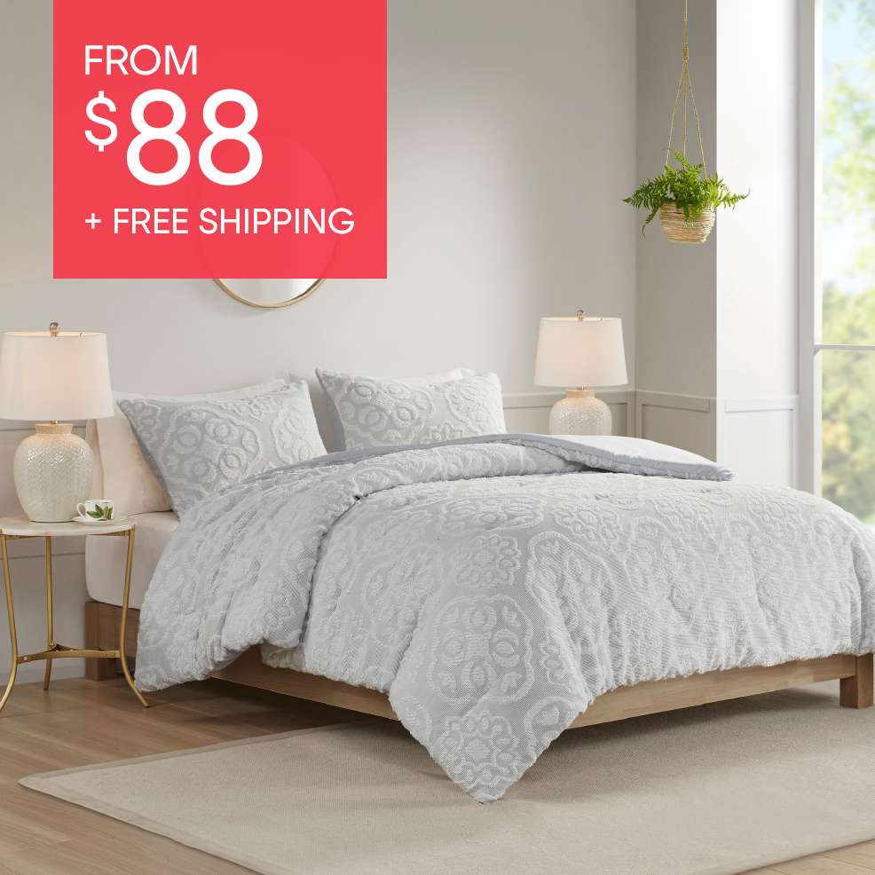 FROM $88 + FREE SHIPPING. A bed with a white comforter and pillows.
