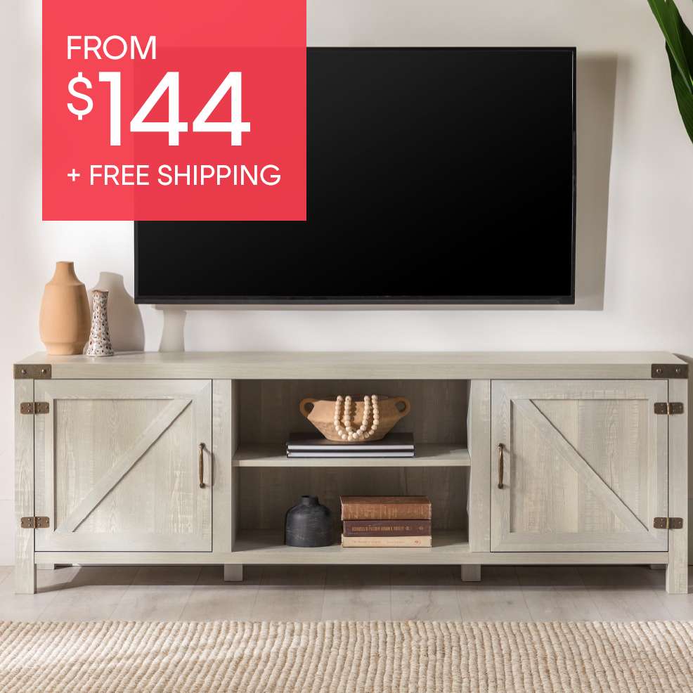FROM $144 + FREE SHIPPING. A light gray wooden TV stand with a black TV above it.
