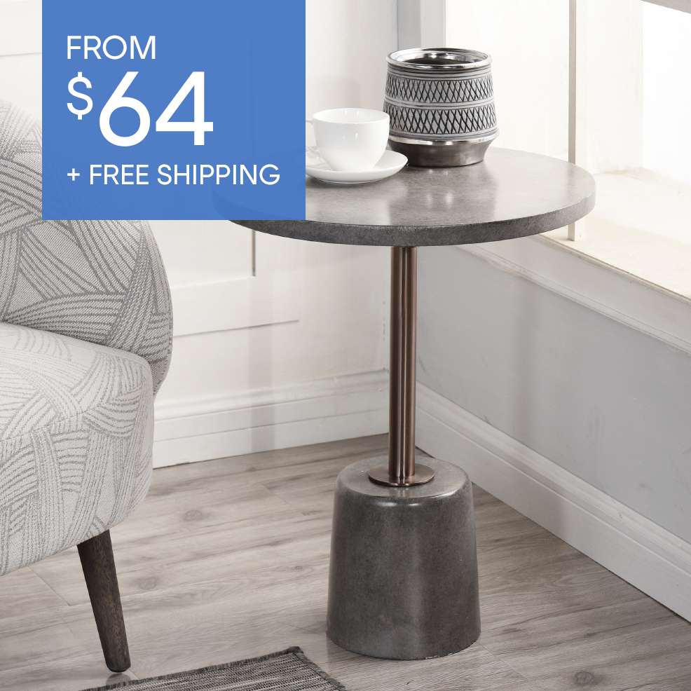 FROM $64 + FREE SHIPPING. A small, round side table with a concrete top and base, and a copper-colored metal stem.
