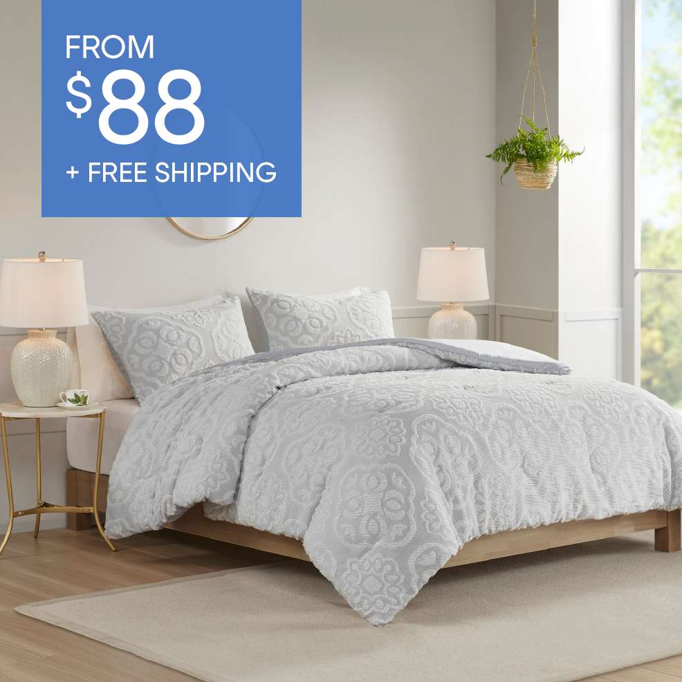 FROM $88 + FREE SHIPPING. A bed with a white comforter and pillows.
