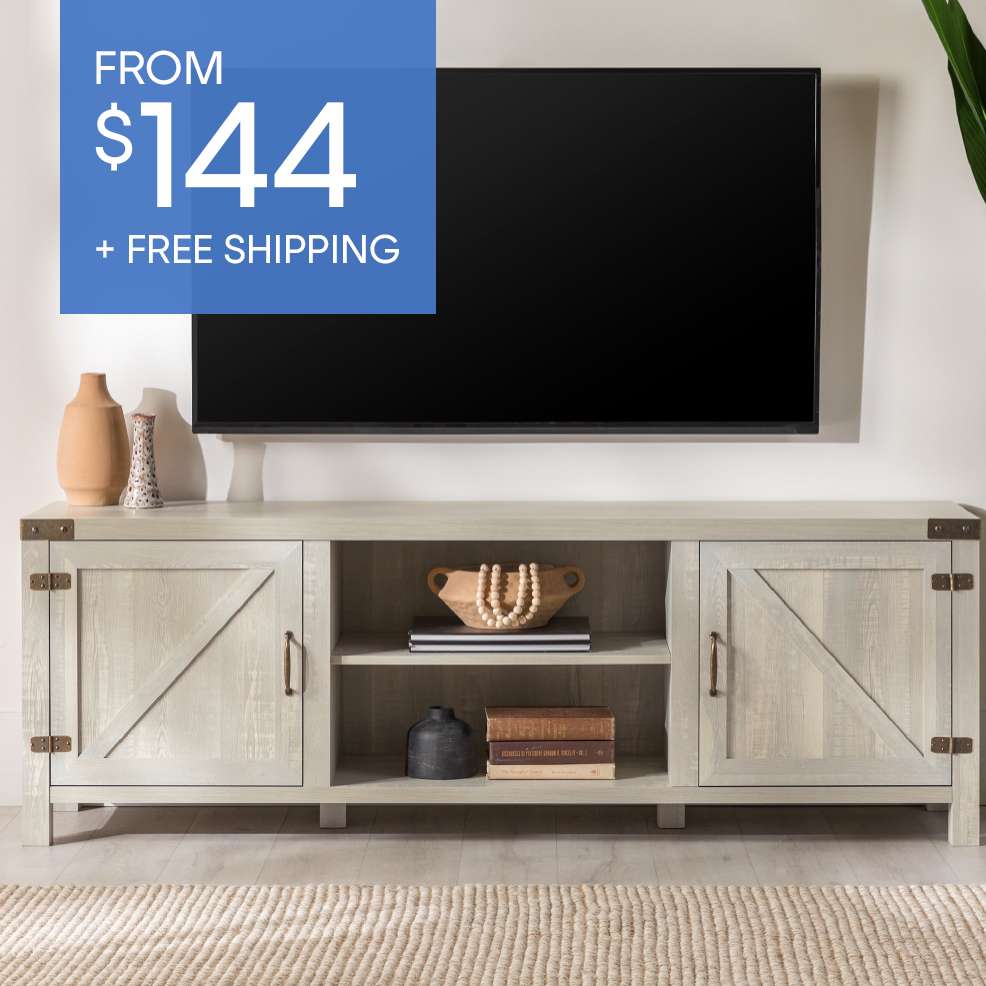 FROM $144 + FREE SHIPPING. A light gray wooden TV stand with a black TV above it.
