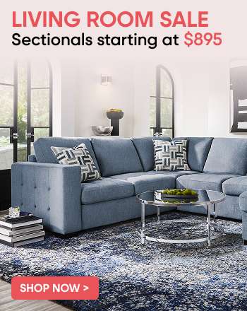 LIVING ROOM SALE Sectionals starting at $895. A blue sectional sofa in a living room.
