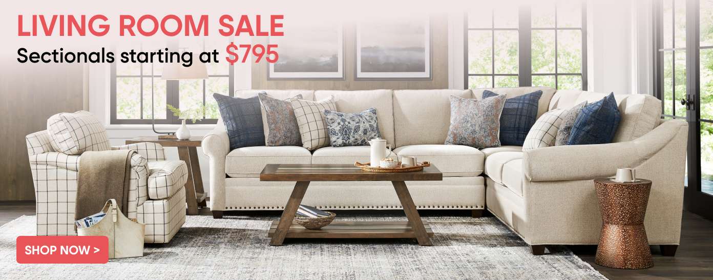LIVING ROOM SALE Sectionals starting at $795. A living room with a sectional sofa, armchair, and coffee table.
