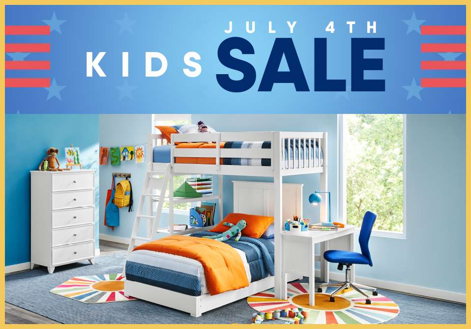 KIDS SALE JULY 4TH. A white bunk bed with a desk and a white dresser in a blue room.
