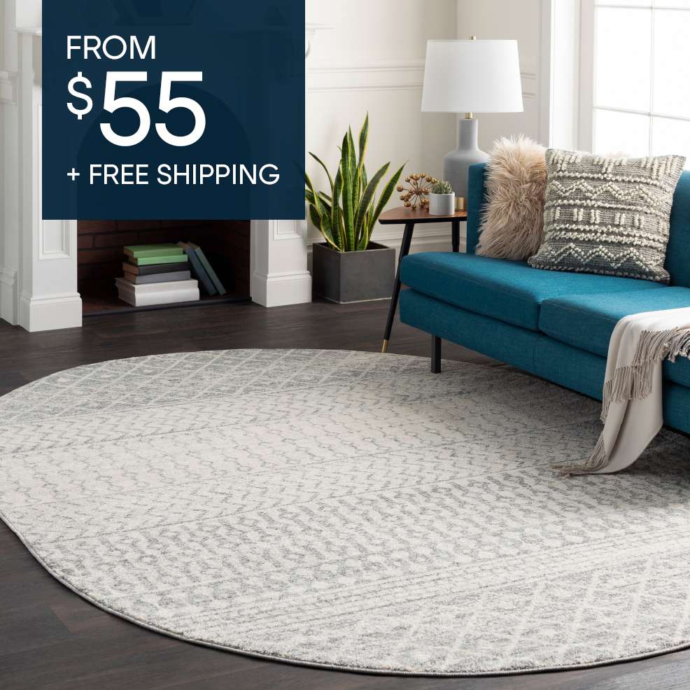 FROM $55 + FREE SHIPPING. A round rug in a living room.
