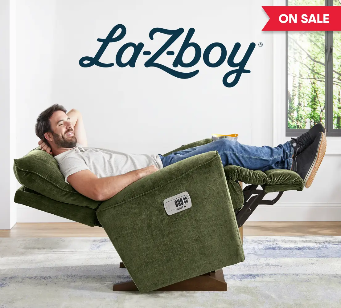 La-Z-Boy ON SALE: A man relaxing in a green upholstered power recliner.