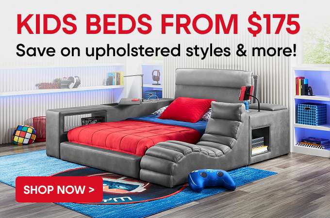 KIDS BEDS FROM $175. Save on upholstered styles & more! A gray upholstered kids bed with a red comforter.
