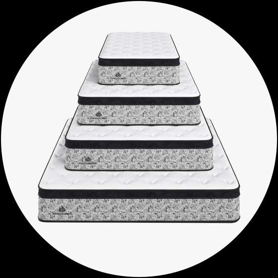 Mattresses stacked on top of each other.
