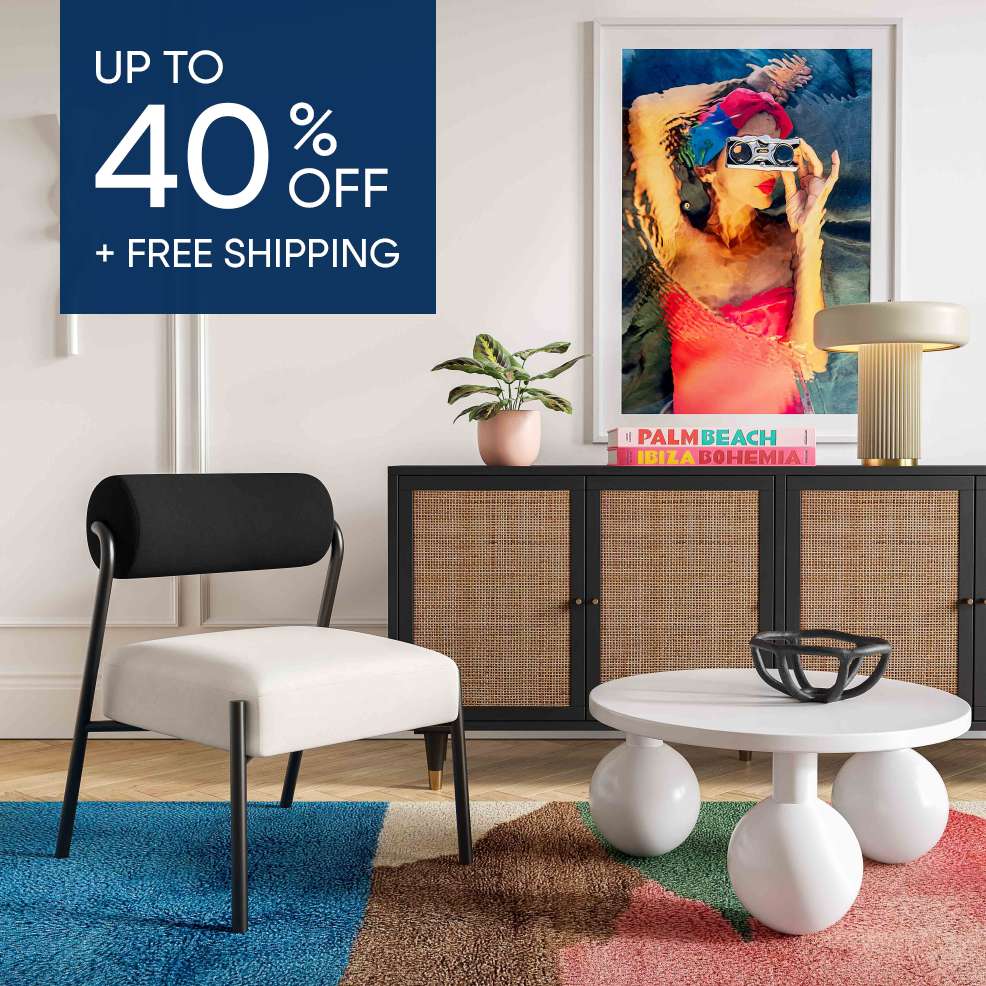 Up to 40% off + free shipping. A modern living room with furniture and a colorful rug.
