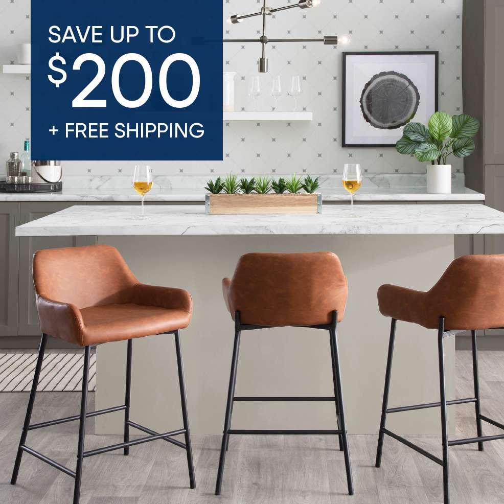 SAVE UP TO $200 + FREE SHIPPING. Three brown leather bar stools with black legs in a kitchen.
