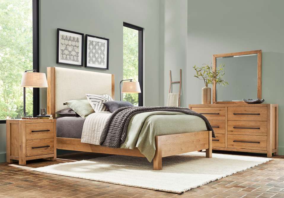 Bedroom furniture set with a bed, nightstands, and dresser.

