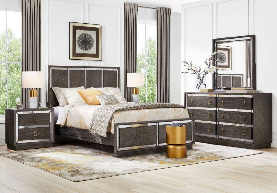 Bedroom furniture set with a bed, nightstands, dresser, and mirror.
