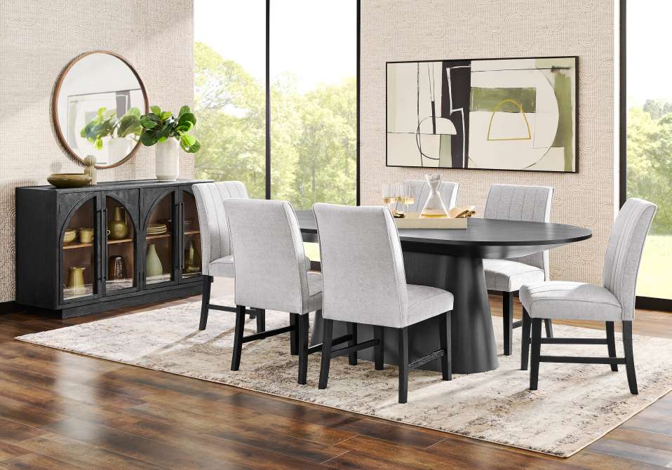 Dining room set with a black table, gray chairs, and a black sideboard.
