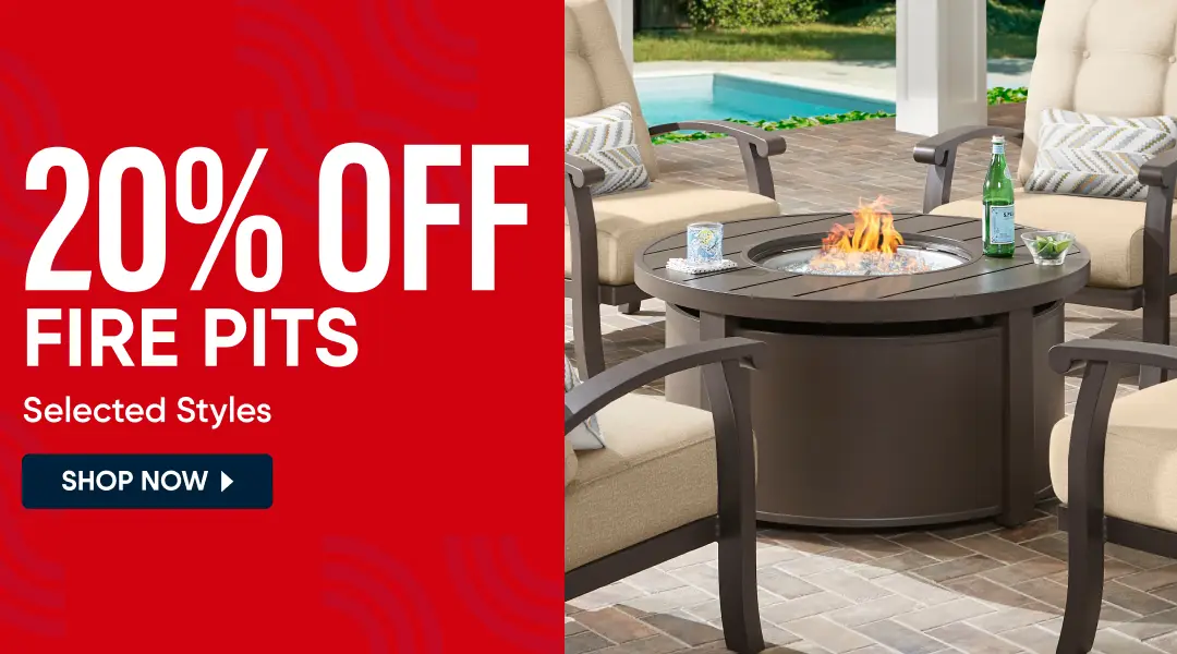 20% OFF FIRE PITS Selected Styles. A round, dark brown outdoor fire pit table with a lit fire, surrounded by patio chairs.