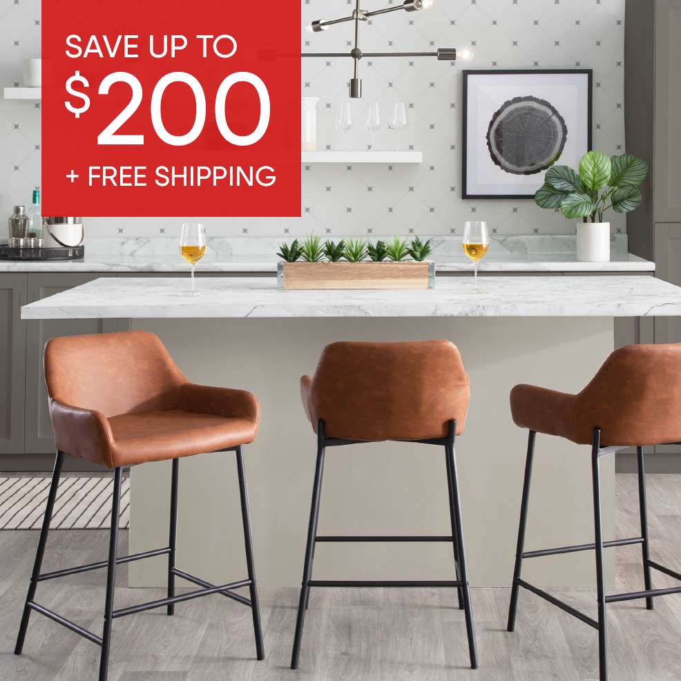 SAVE UP TO $200 + FREE SHIPPING. Three brown leather bar stools with black legs in a kitchen.