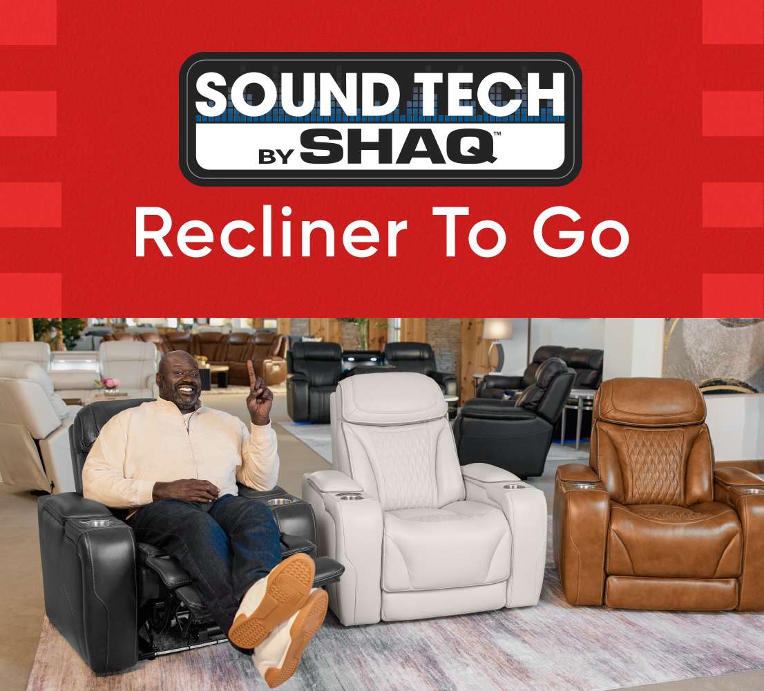 SOUND TECH by SHAQ Recliner To Go. Shaq sitting in a black recliner, pointing up.
