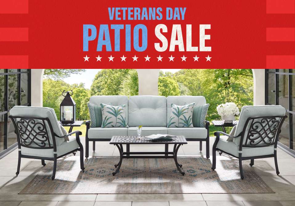 Veterans Day Patio Sale. Patio furniture set on a patio.
