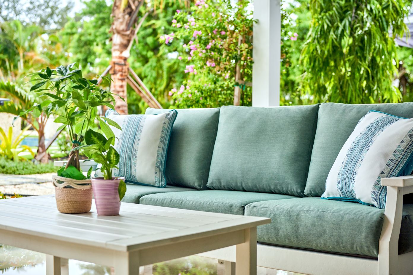 blue couch with tan outdoor table