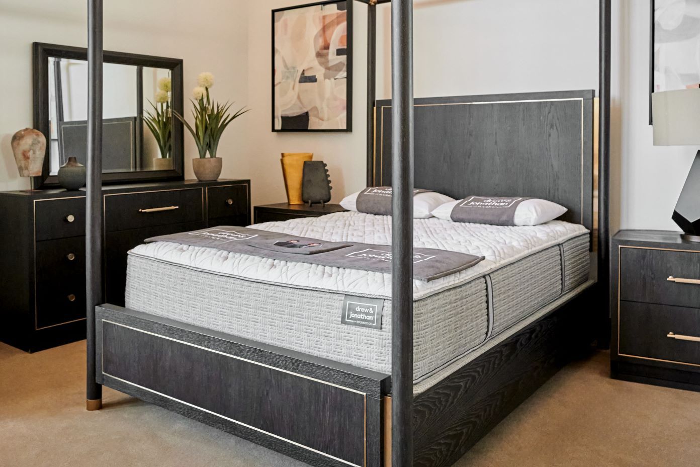 mattress on a dark bedframe 