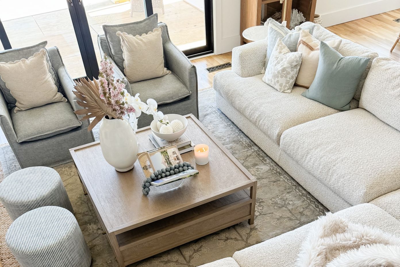 light colored couch with gray furniture