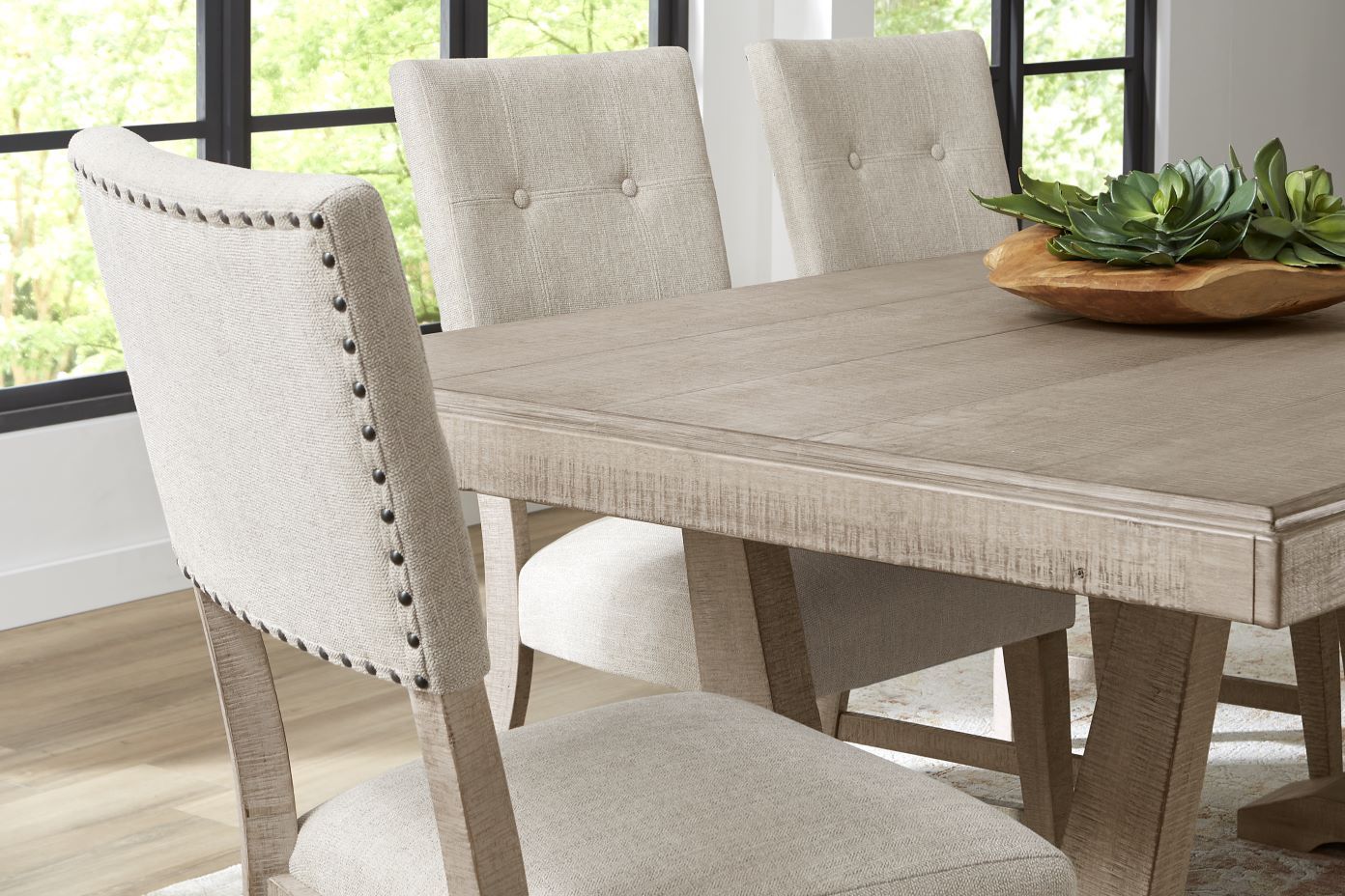 Dining table with upholstered chairs.
