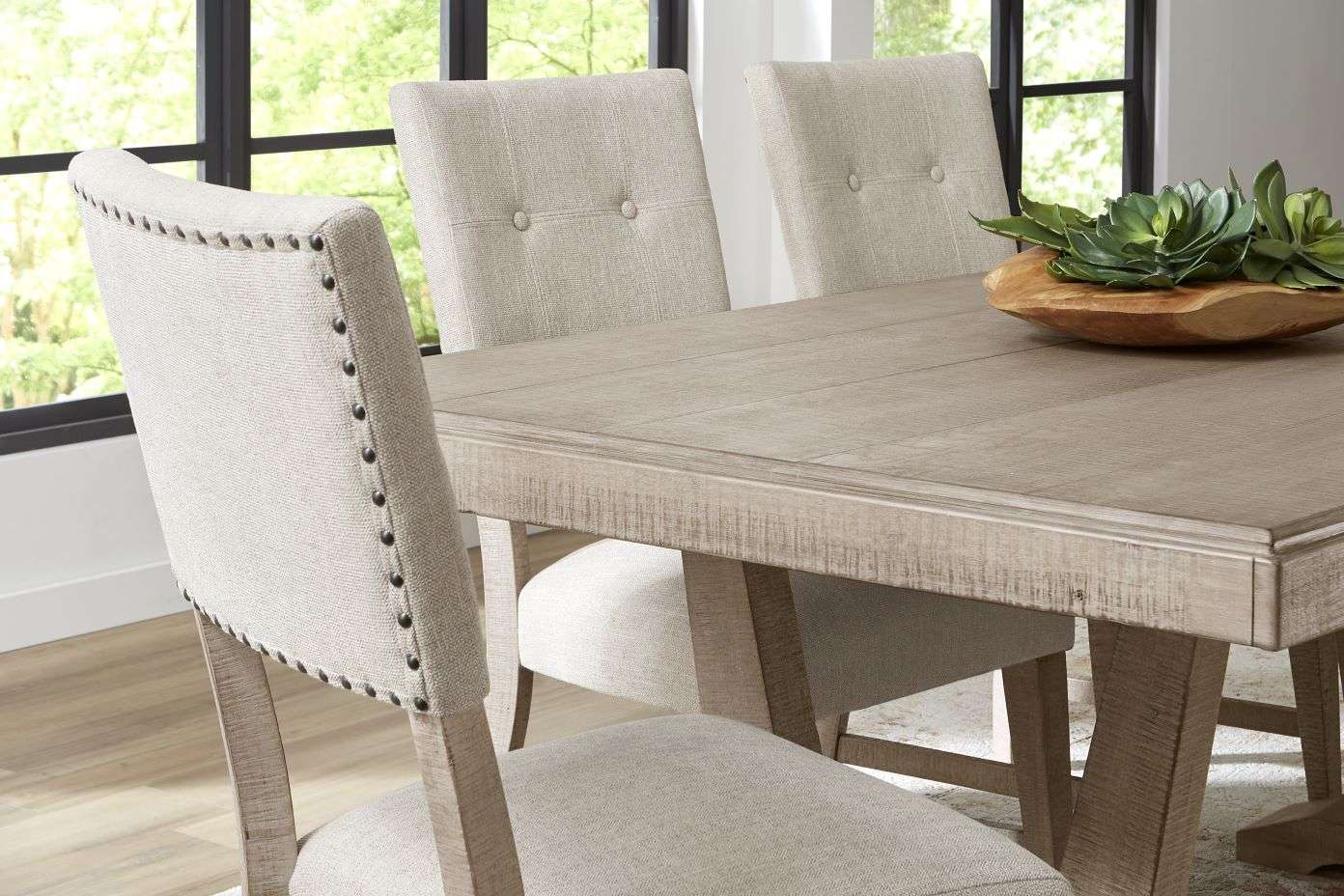 Dining table with upholstered chairs.