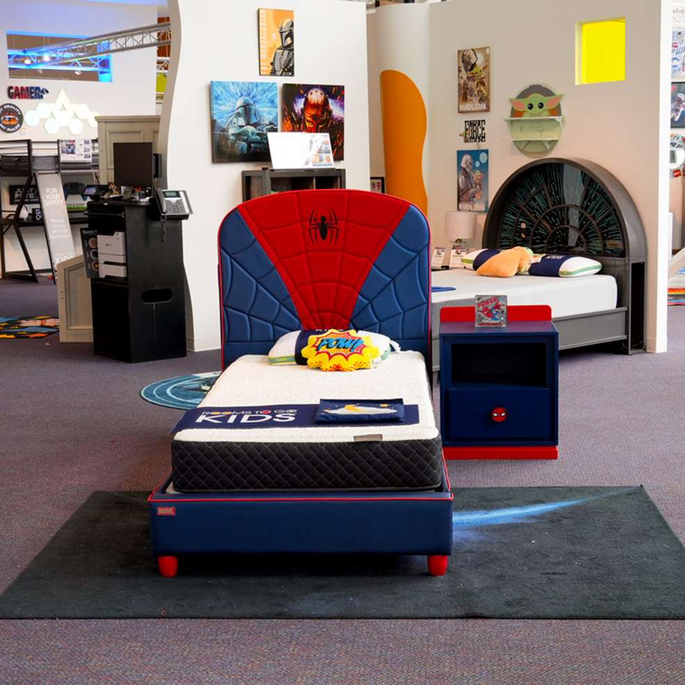 Spider-Man themed bed with a matching nightstand.

