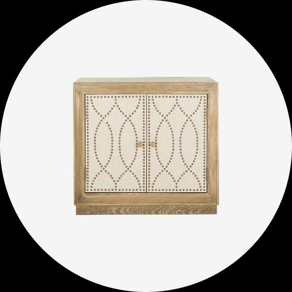 Wooden cabinet with two doors, beige fabric panels, and studded details.
