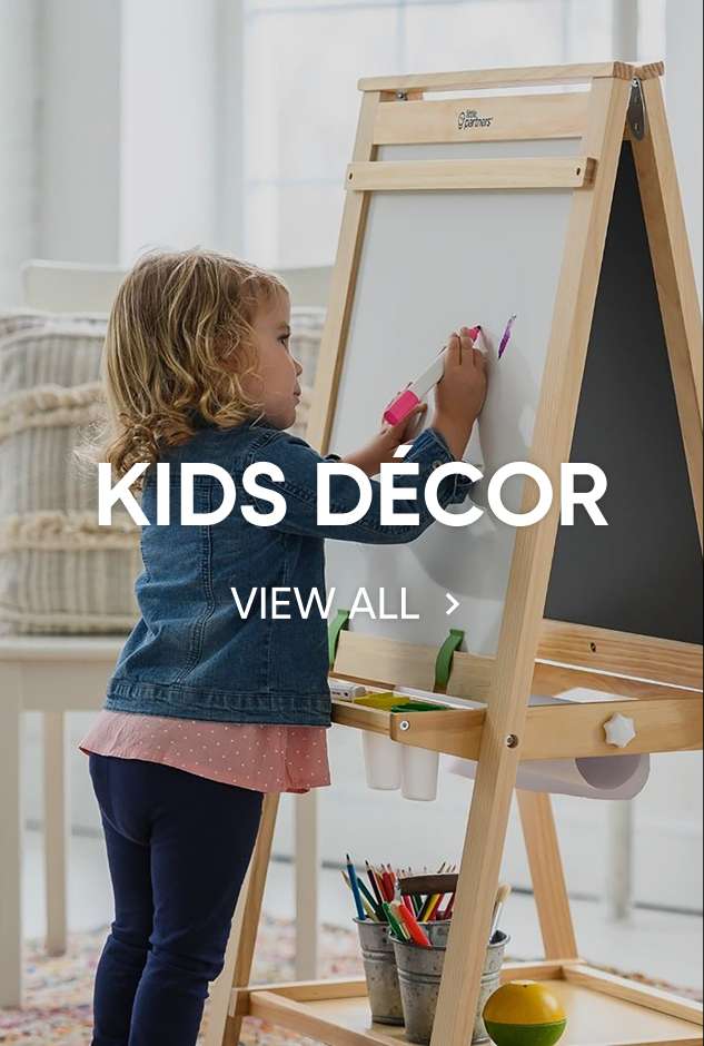 KIDS DÉCOR. View all. A young girl drawing on a white board.
