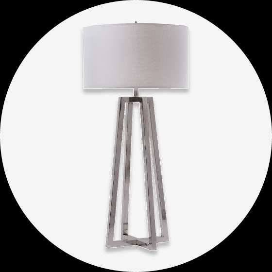 Floor lamp with a white lampshade and a silver metal base.
