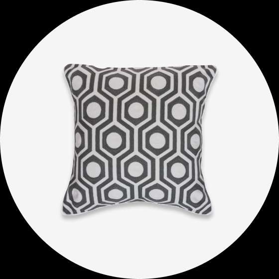 Gray and white geometric patterned pillow.
