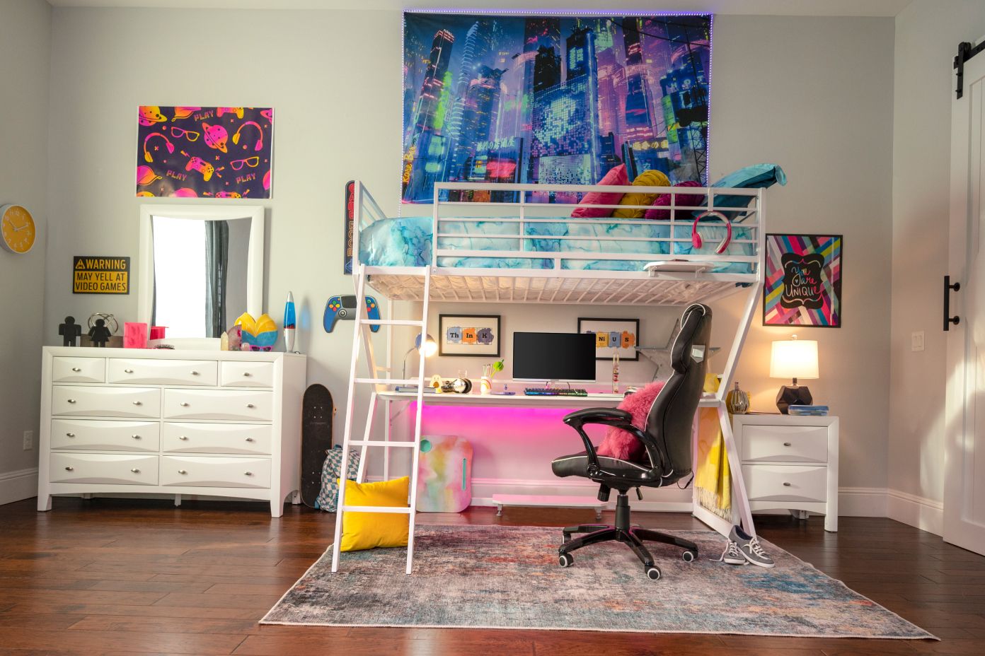A bedroom with a white bunk bed, desk, and gaming chair.

