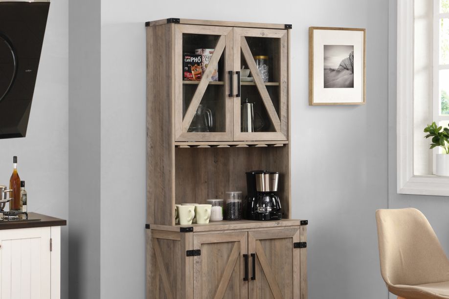 Wooden coffee bar cabinet with glass doors and a coffee maker.

