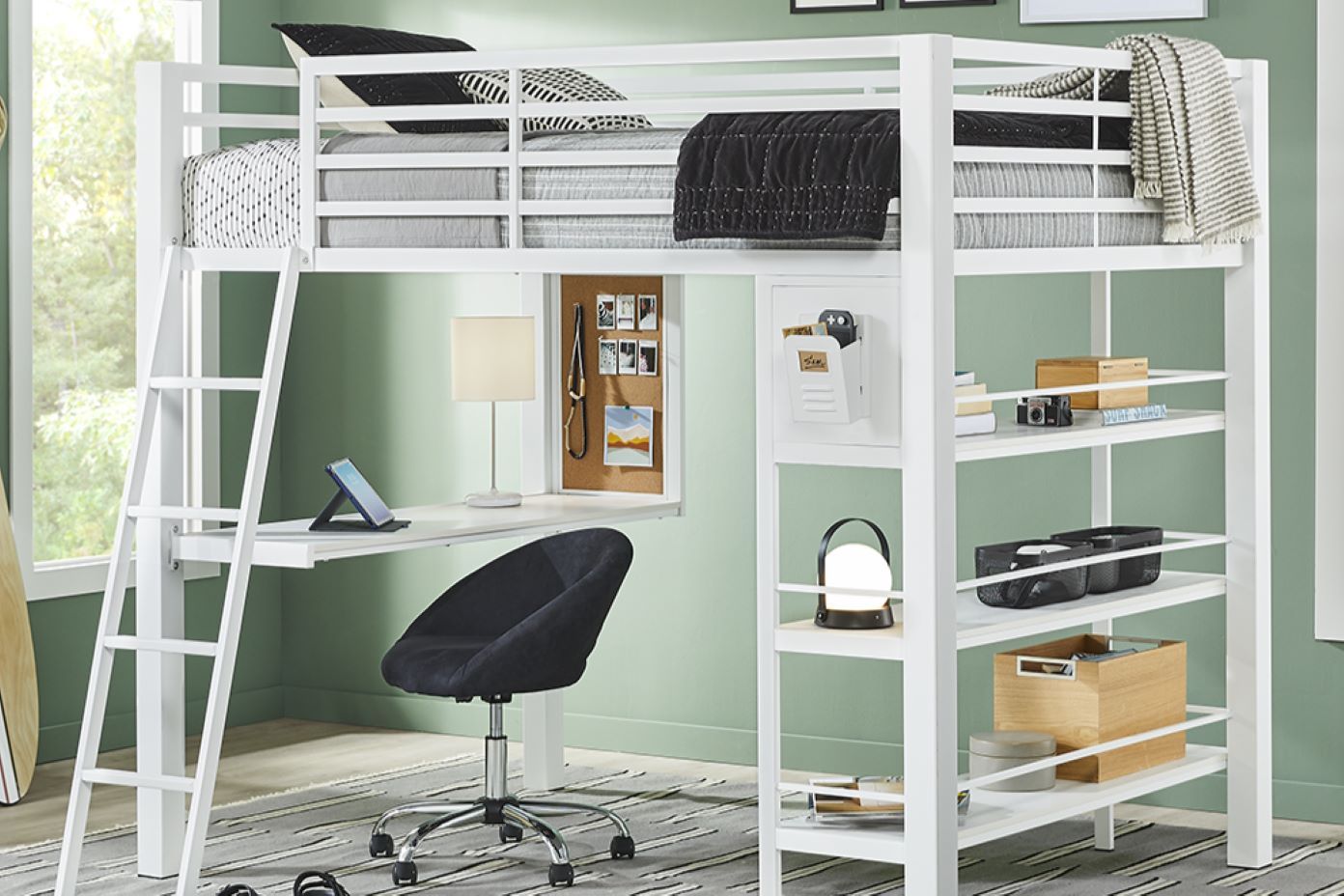 White metal loft bed with desk, shelves, and a black chair.