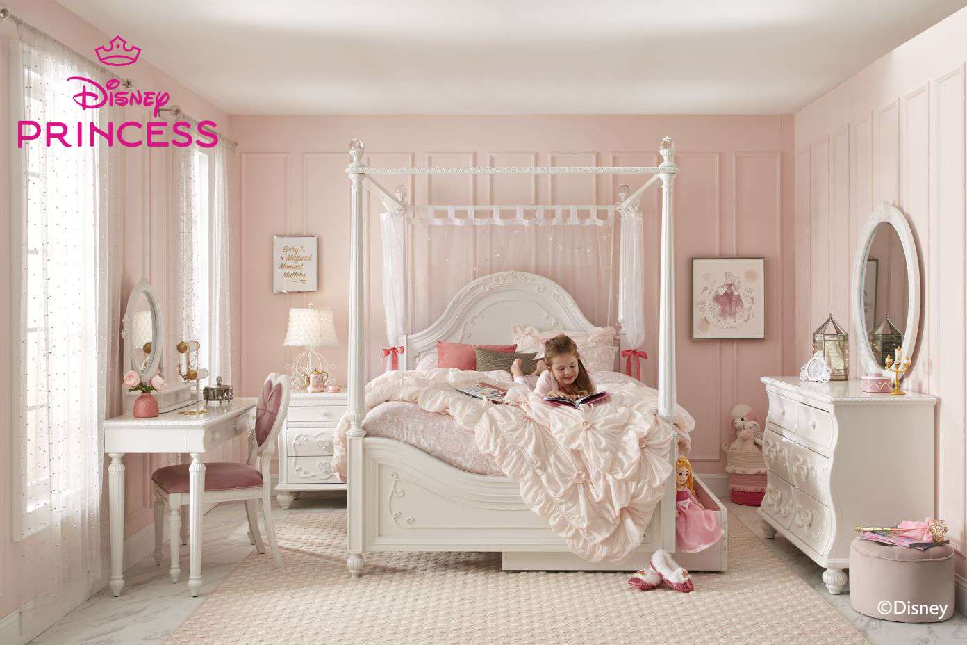 Disney Princess bedroom with a girl reading in bed.

