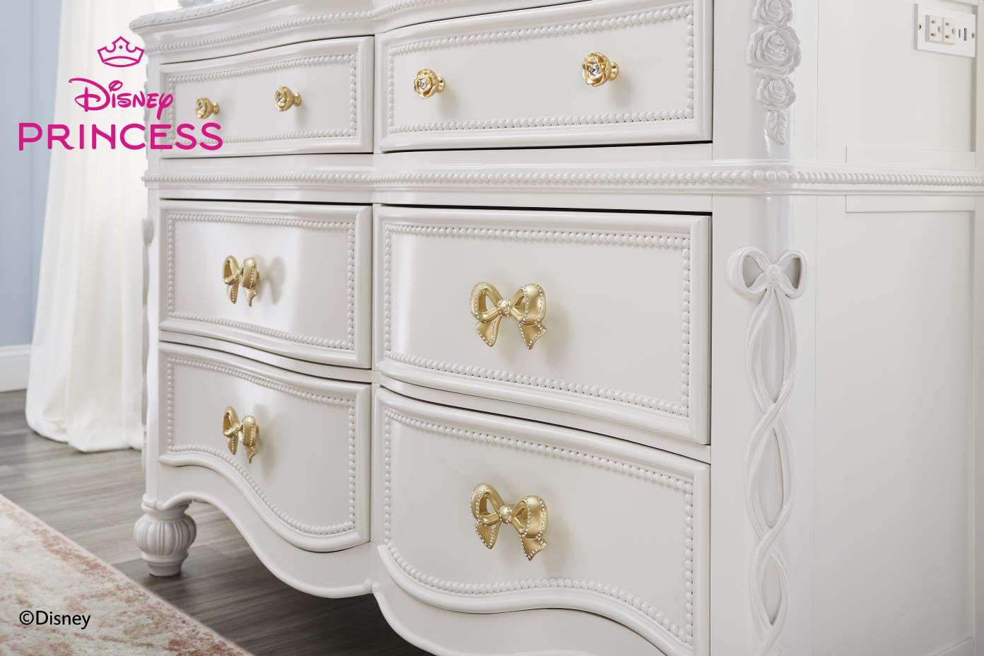 Disney Princess dresser. White with gold bow and rose details.
