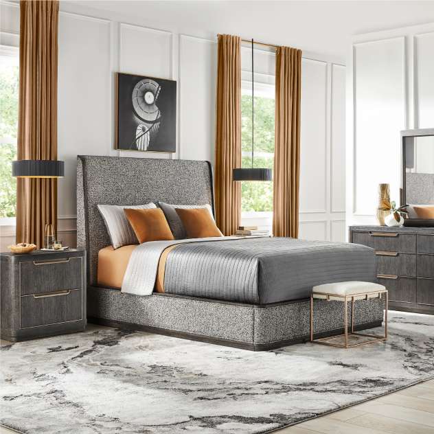 Bedroom set with a bed, nightstand, dresser, and rug.

