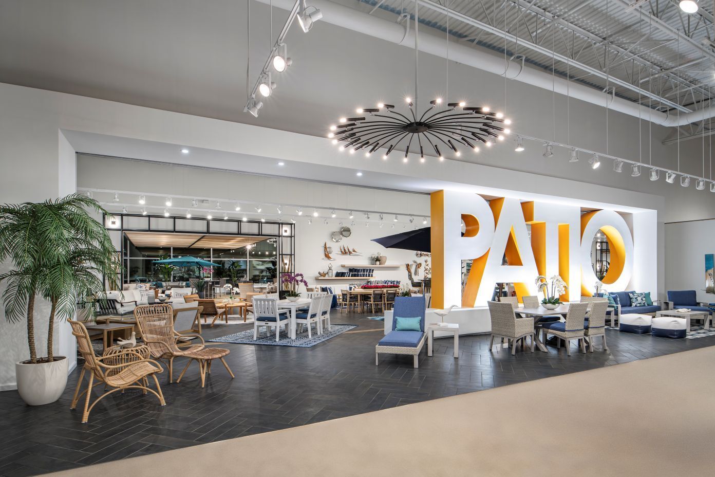 PATIO. Interior of a furniture store with patio furniture displays.
