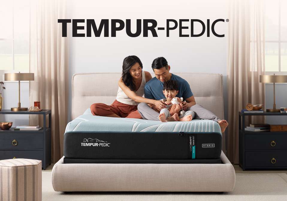 TEMPUR-PEDIC. A family sits on a mattress.
