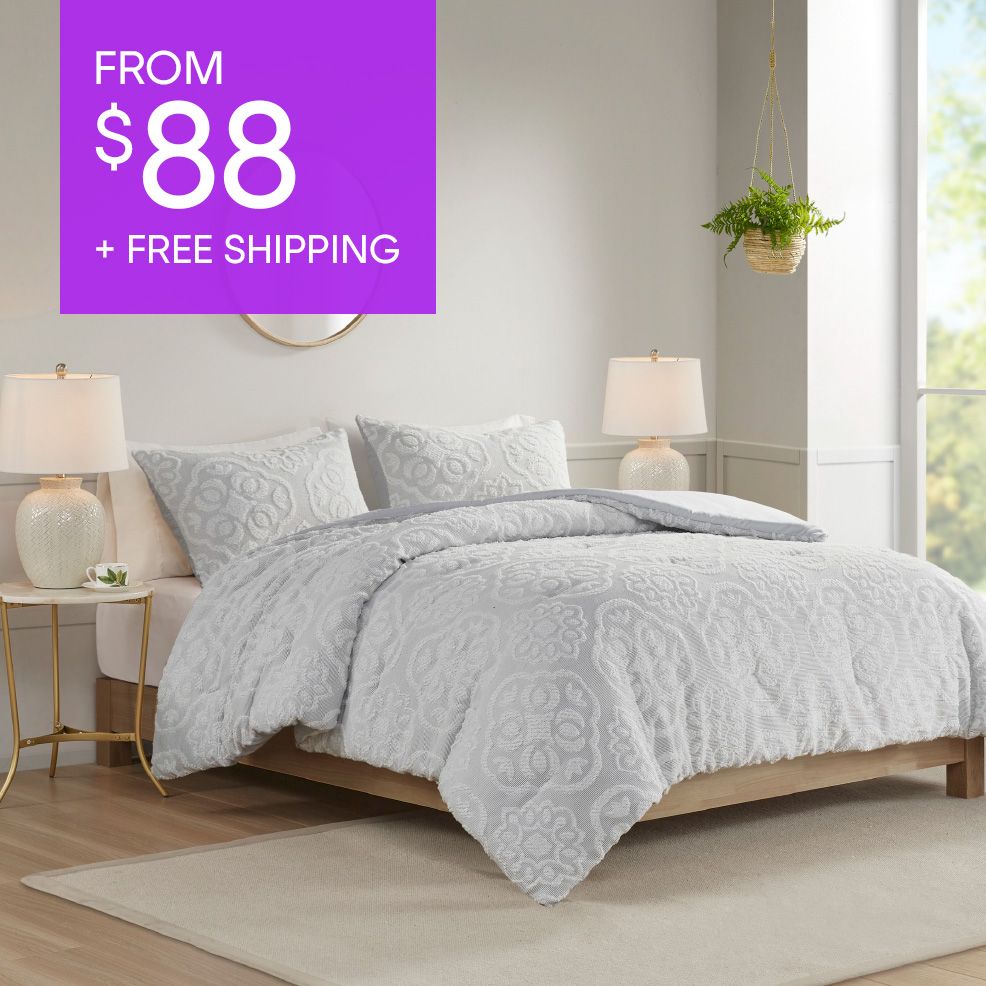 FROM $88 + FREE SHIPPING. A bed with a white comforter and pillows.
