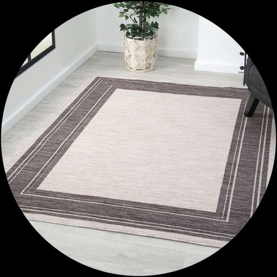 Beige and brown rectangular rug.
