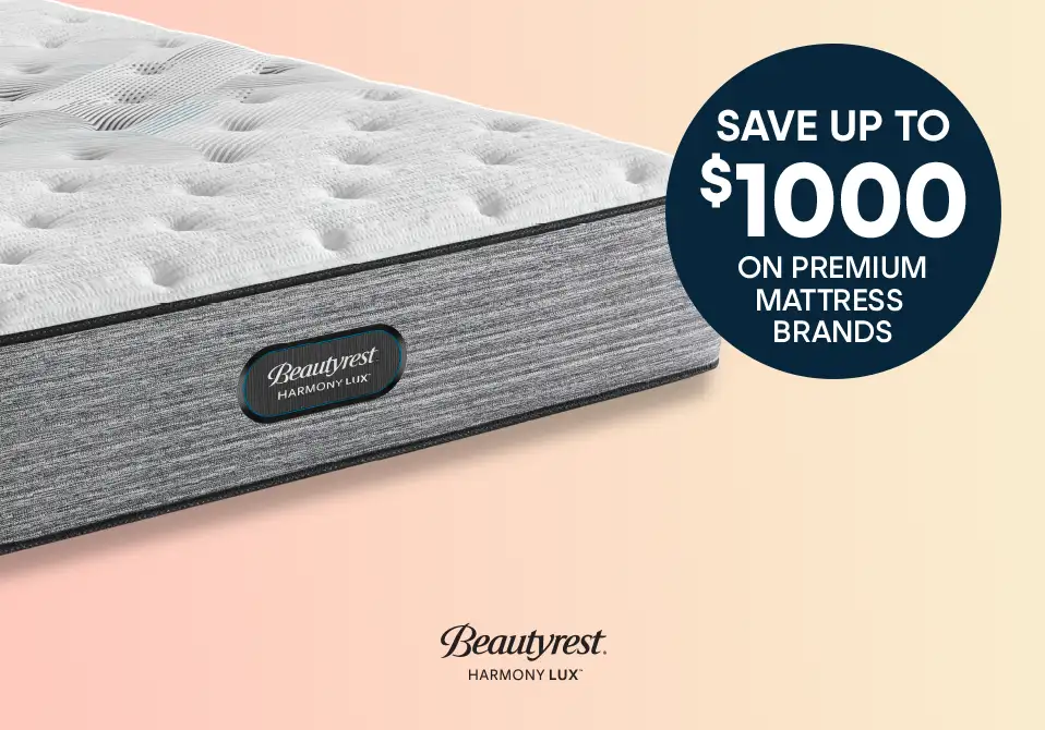 SAVE UP TO $1000 ON PREMIUM MATTRESS BRANDS. A Beautyrest Harmony Lux mattress.
