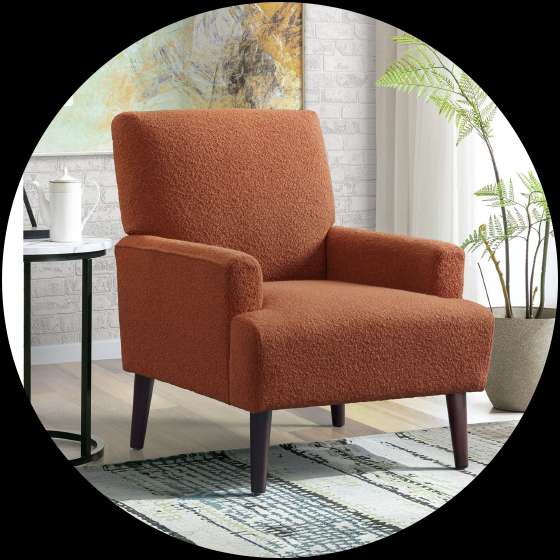 Orange armchair with dark wooden legs.
