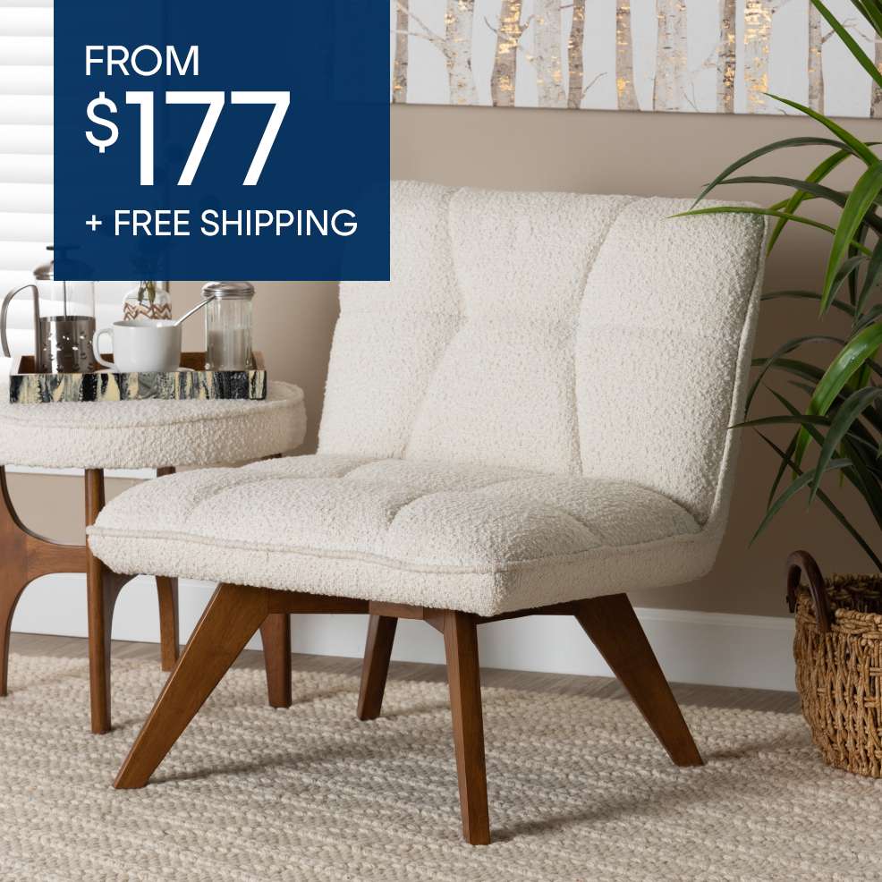 FROM $177 + FREE SHIPPING. A cream-colored armchair with wooden legs.
